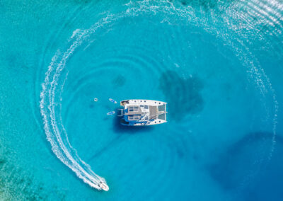 Aerial view of the Lagoon 560 catamaran, anchored in the crystal-clear waters of Croatia