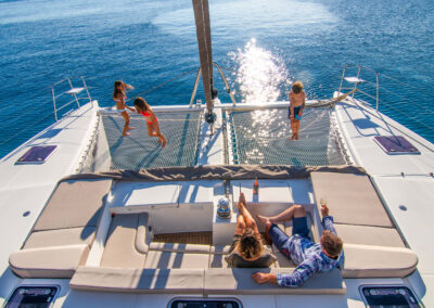 Happy family creating unforgettable memories on a luxurious Lagoon 560 catamaran.